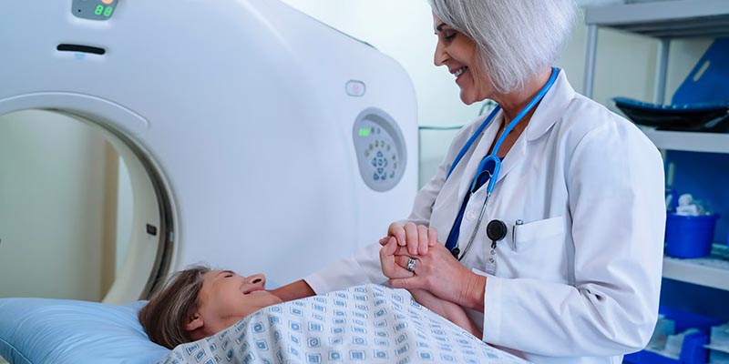 doctor helping patient during scan