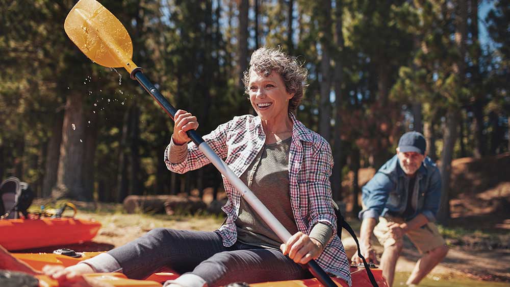 Woman on a kayak | Colorectal cancer warning signs